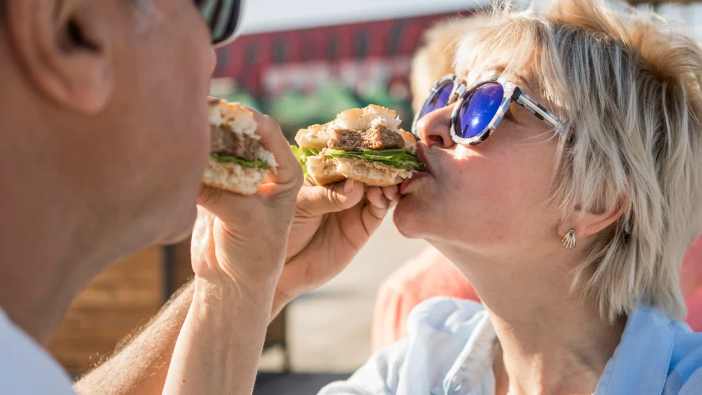older-couple-enjoying-camden-market-foods