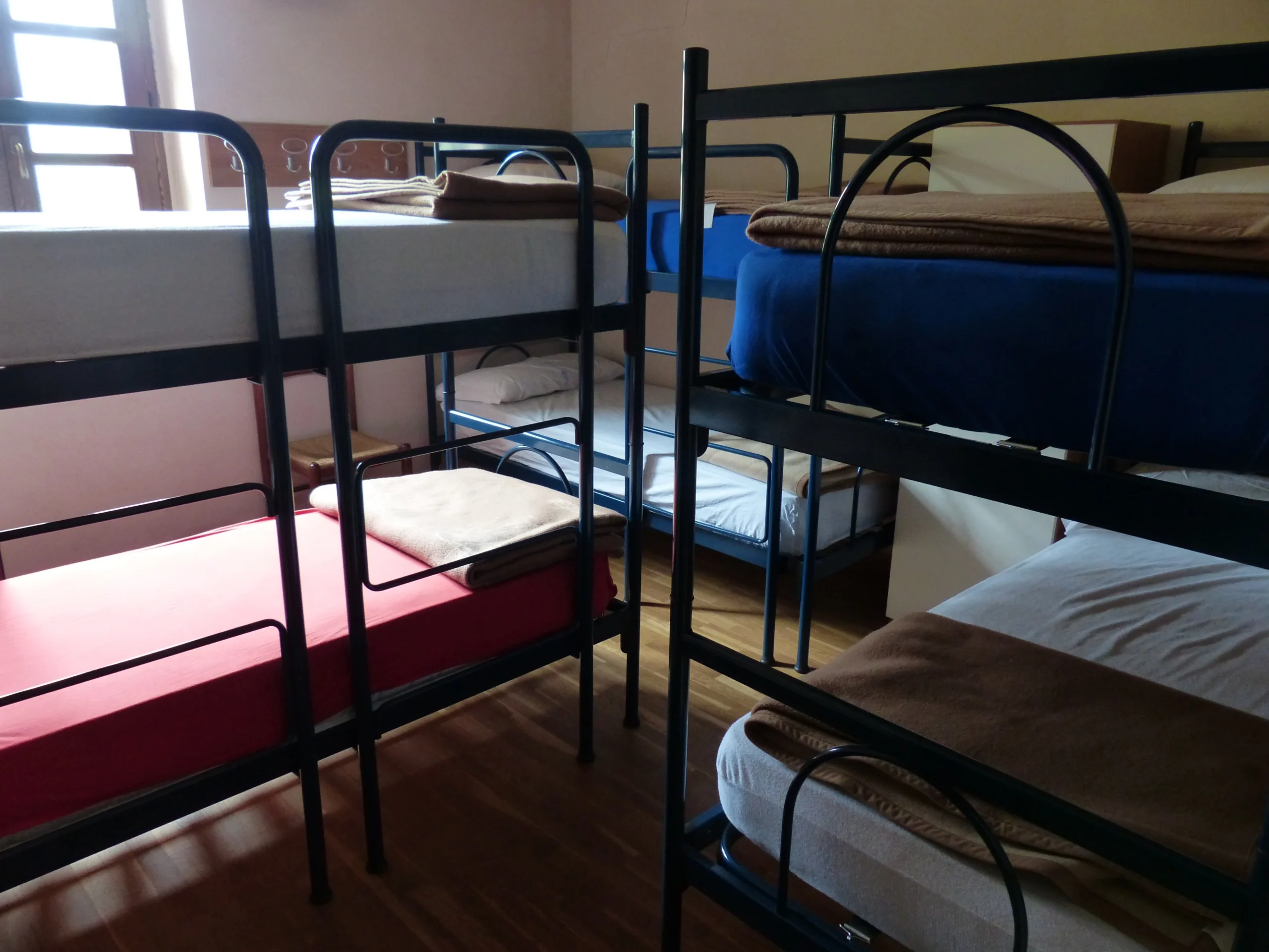 Modern London hostel dorm room with bunk beds and colourful decor