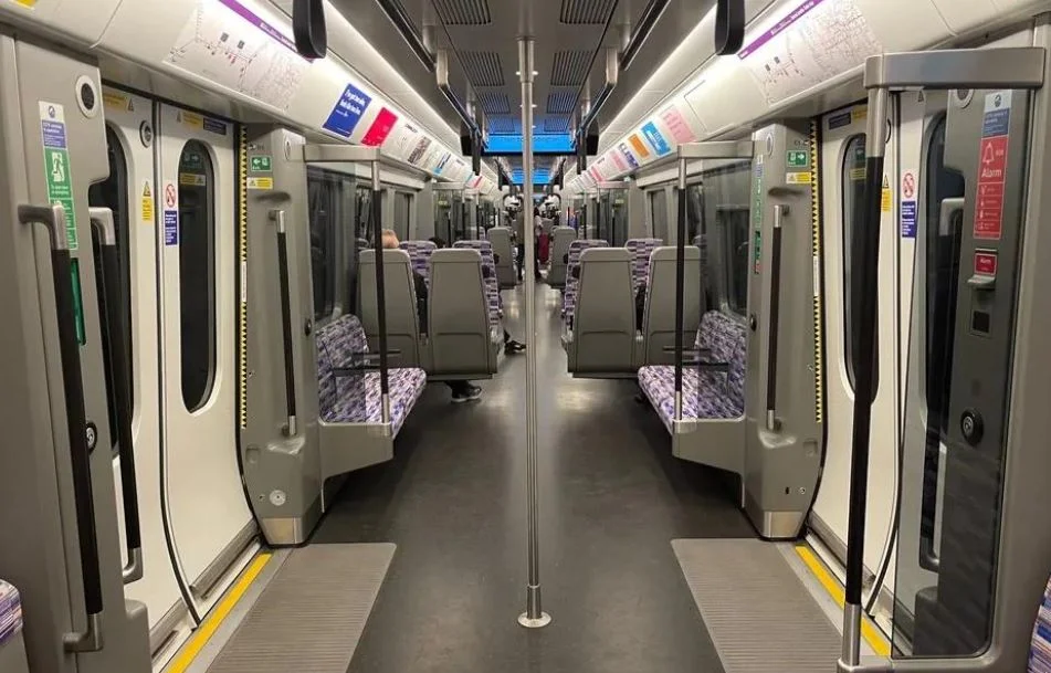 A purple Elizabeth line train at a London platform