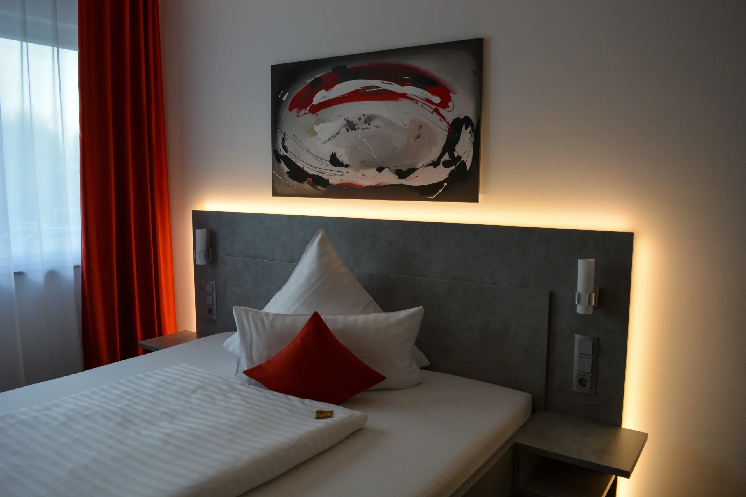 Interior of a mid-range London hotel room with modern decor