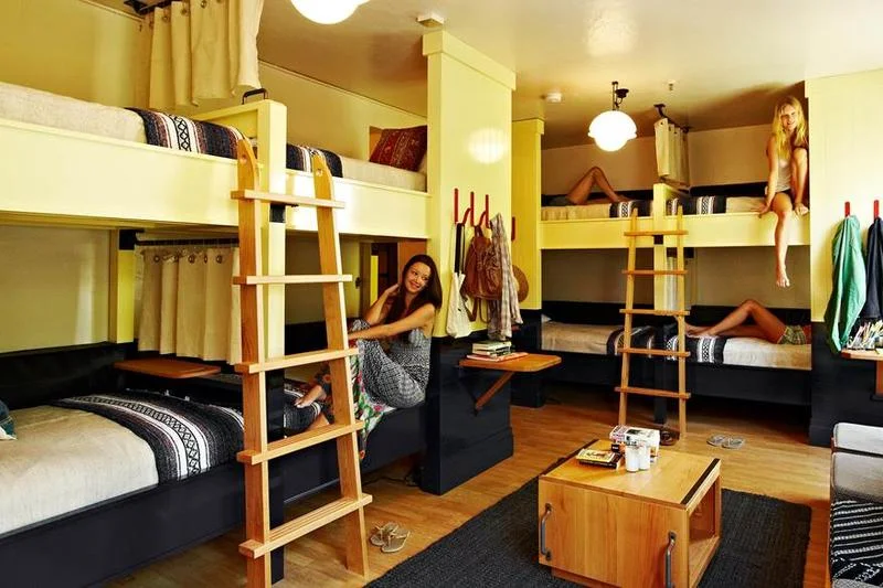 Hostel common area lounge with backpackers meeting London