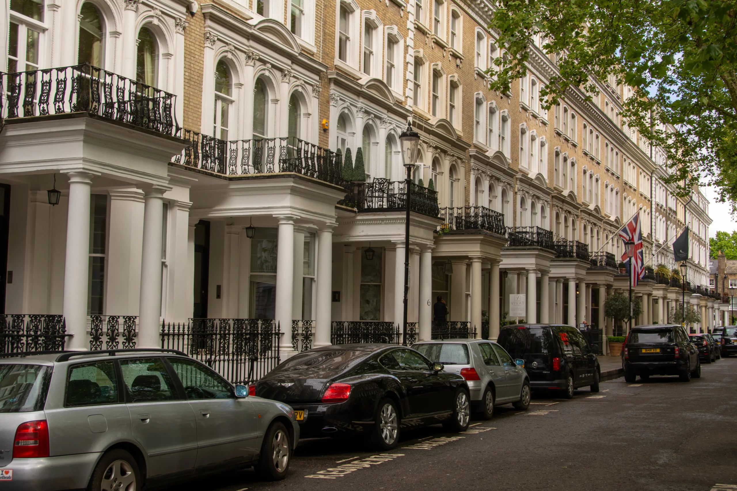 Narrow Georgian street in Mayfair London with parked cars
