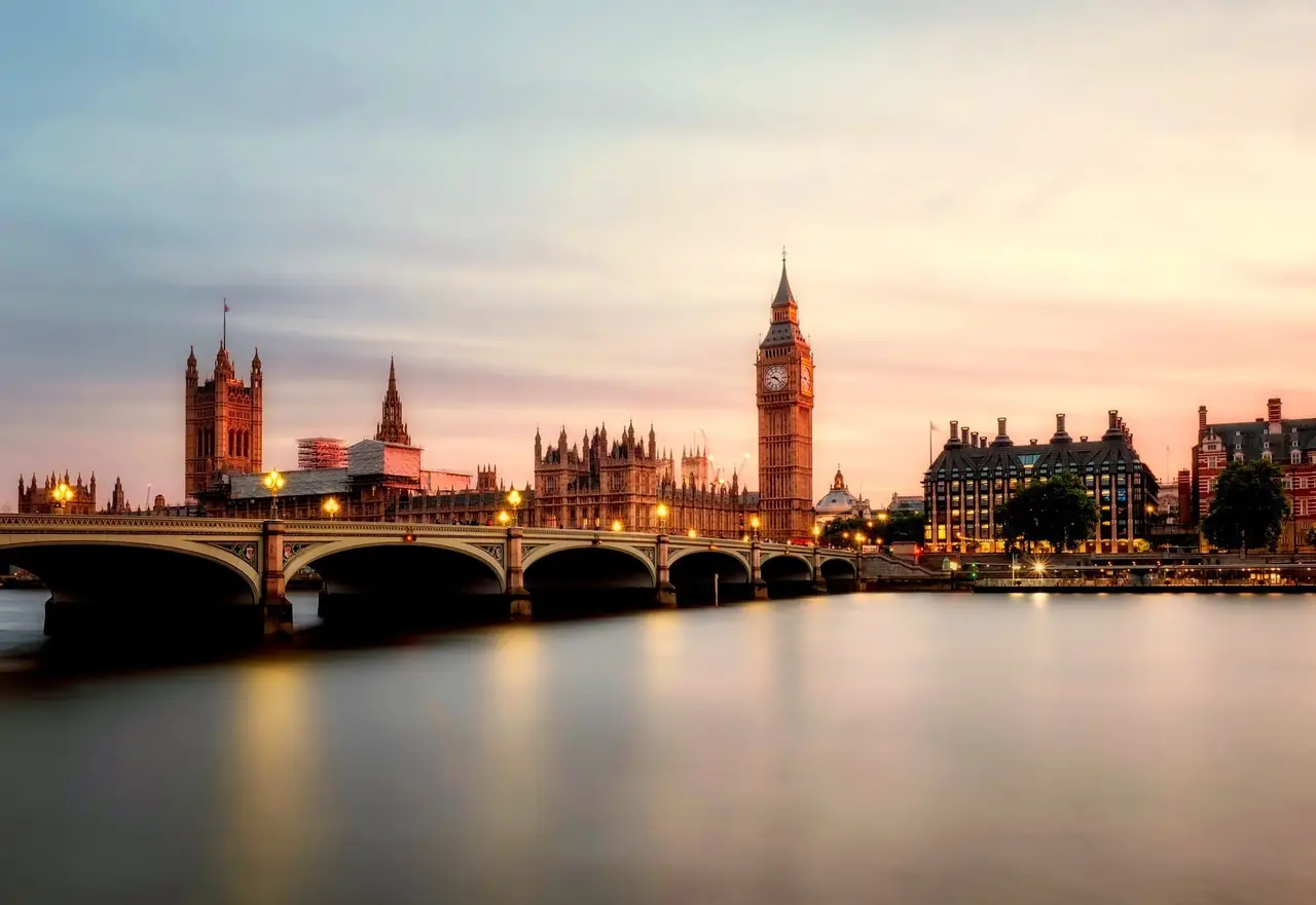 London skyline at sunset: Big Ben, the Houses of Parliament and Westminster Bridge over the River Thames
