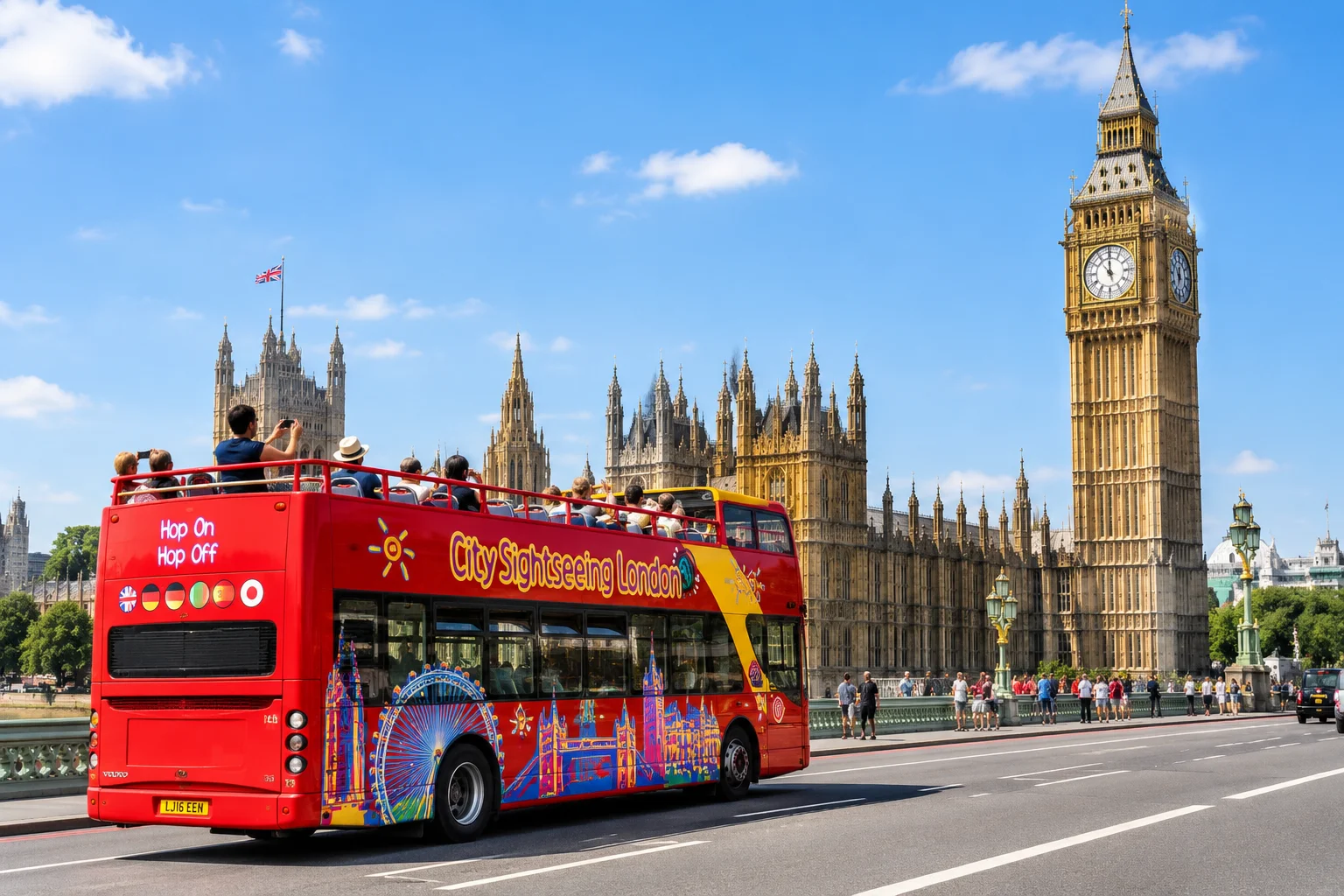An open top red double-decker sightseeing bus passing a London landmark