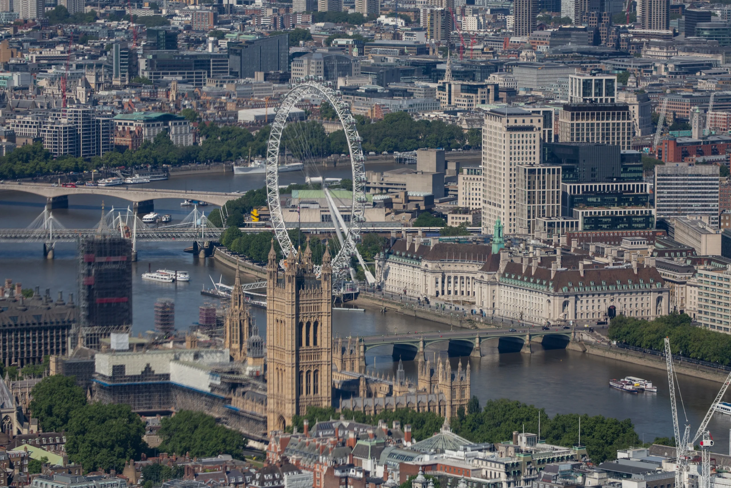 The London Eye against a clear sky over the River Thames