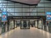 The entrance to Terminal 2 at London Heathrow, the Queen's Terminal, with its glass frontage and covered forecourt.