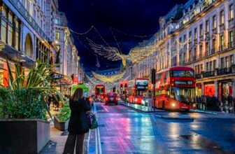 A London street decorated with Christmas lights at night